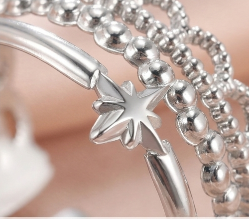 Starlight layered beaded adjustable ring shown from multiple angles with text above.