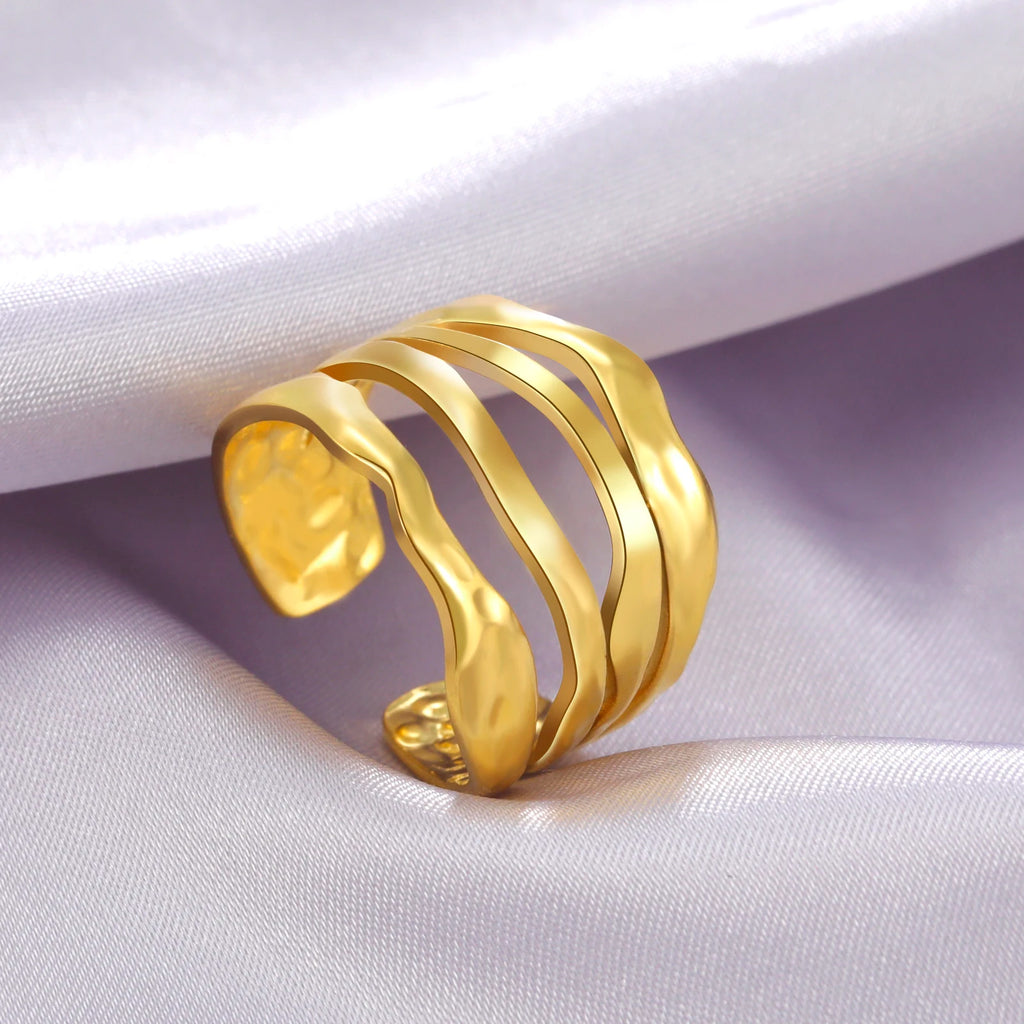 Gold ring on a white fabric background